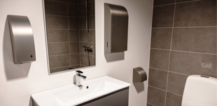 commercial bathroom, hotel hair dryer and commercial soap dispenser